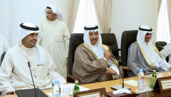 Kuwaiti Prime Minister Sheikh Jaber Al Mubarak Al Sabah (centre) and Kuwaiti parliament speaker Marzouq Al Ghanim (right) attend a meeting between Cabinet members and members of the national assembly in Kuwait City on Wednesday to discuss the government decision to increase petrol prices (AFP photo)